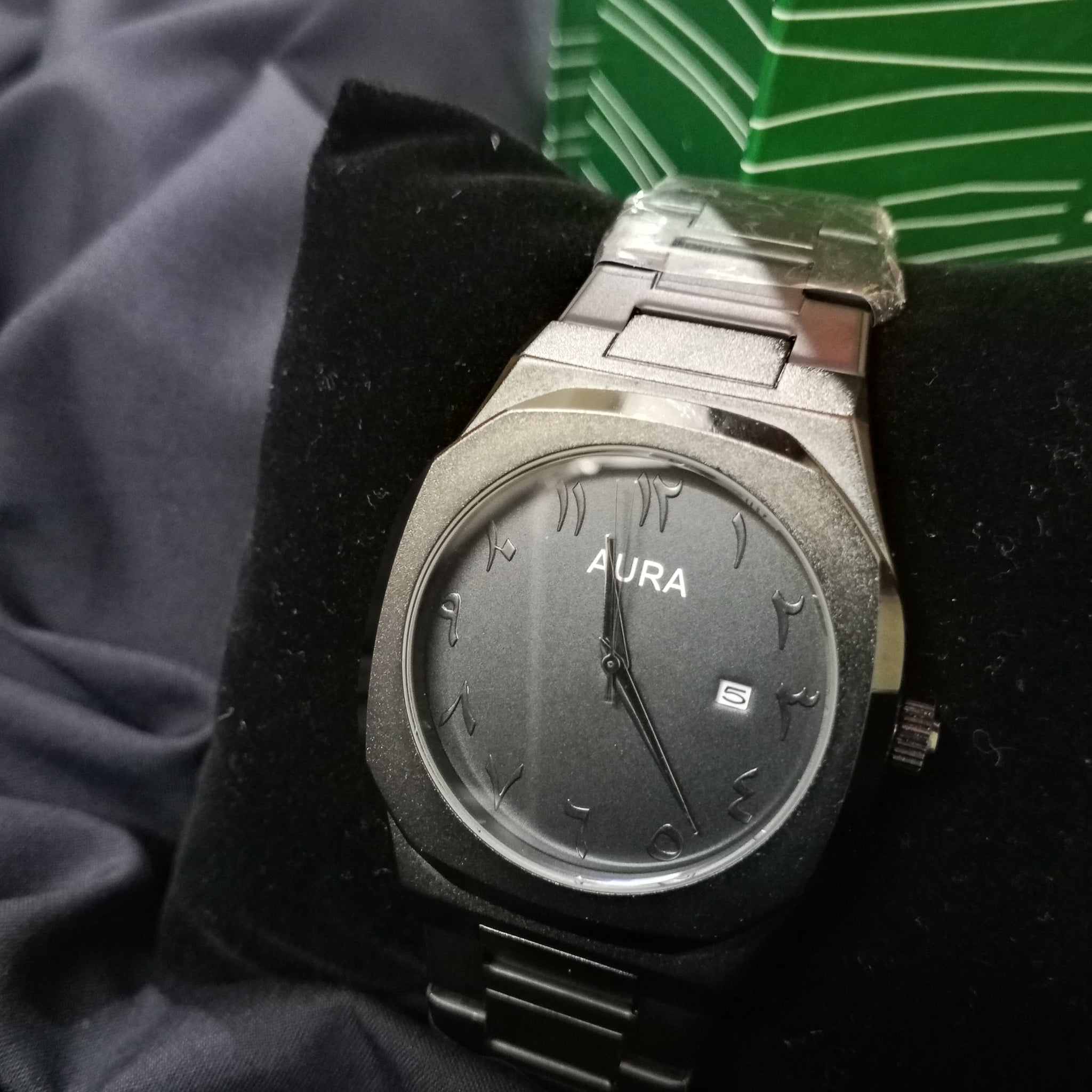 Original black Aura watch with metallic chain